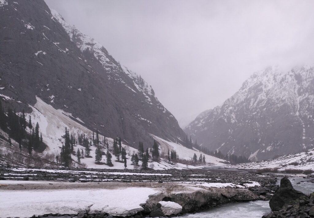 Stunning view of Swat Valley with green hills, blue sky, and peaceful natural environment